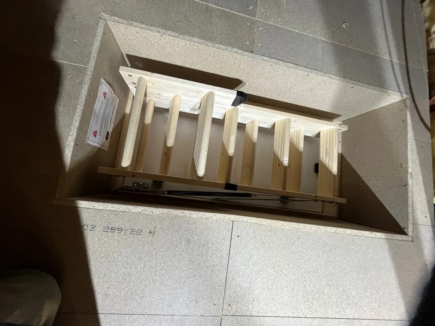 A fitted loft hatch with its ladder folded away