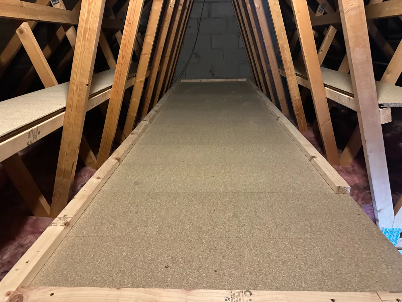 A fully boarded loft floor, flat and clear, ready for storage