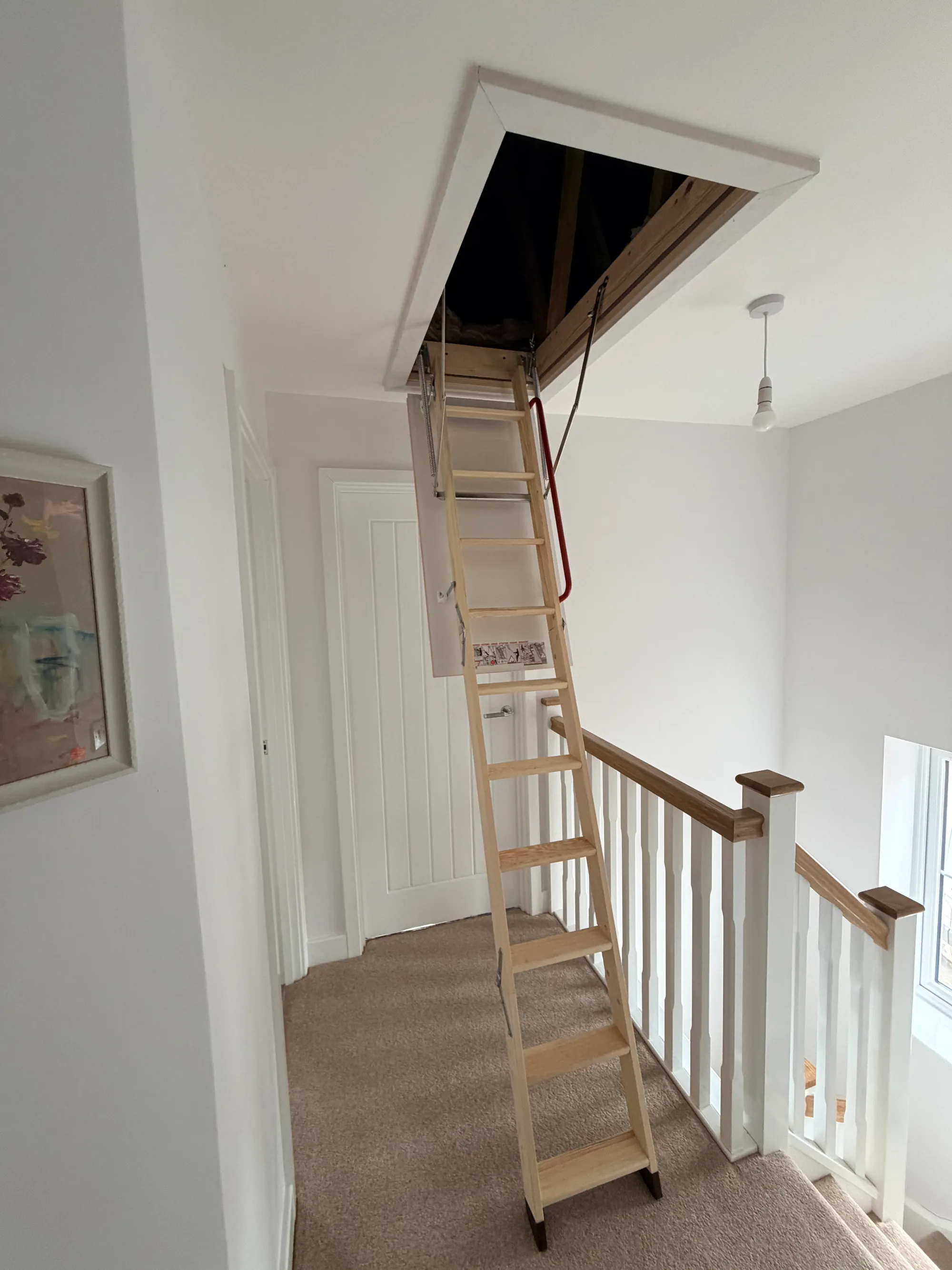 triple wooden Fakro loft ladder installed
