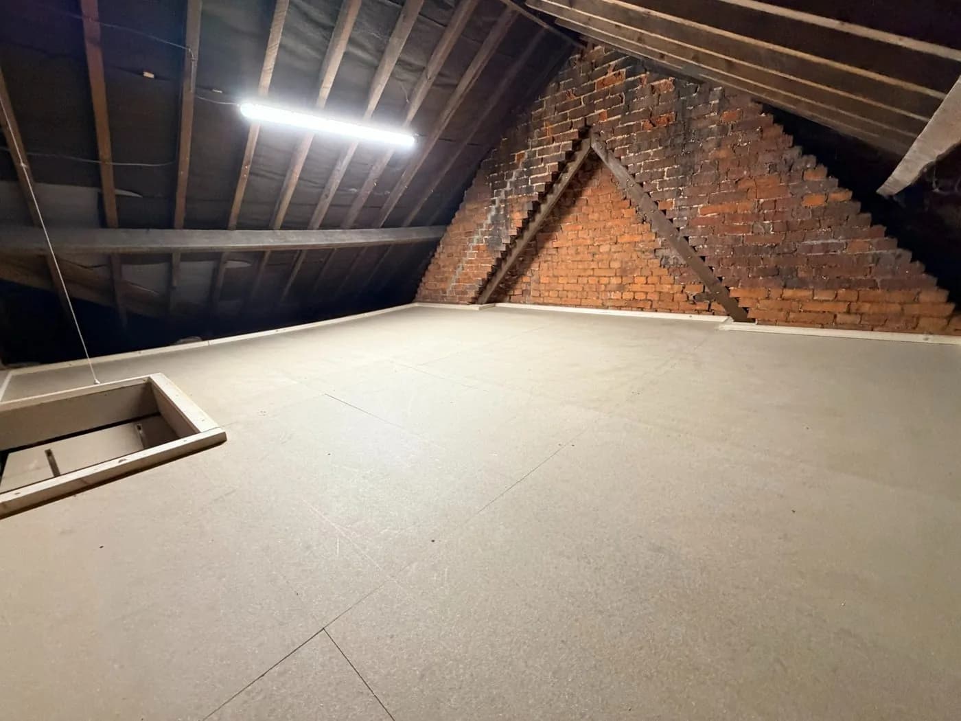 Loft boarding over a lath and plaster ceiling.