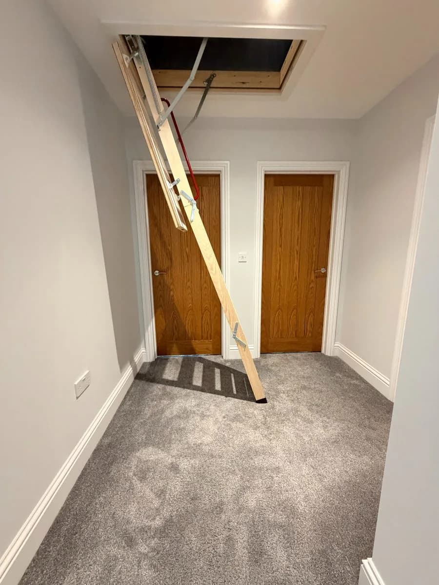 triple wooden loft ladder in new build property