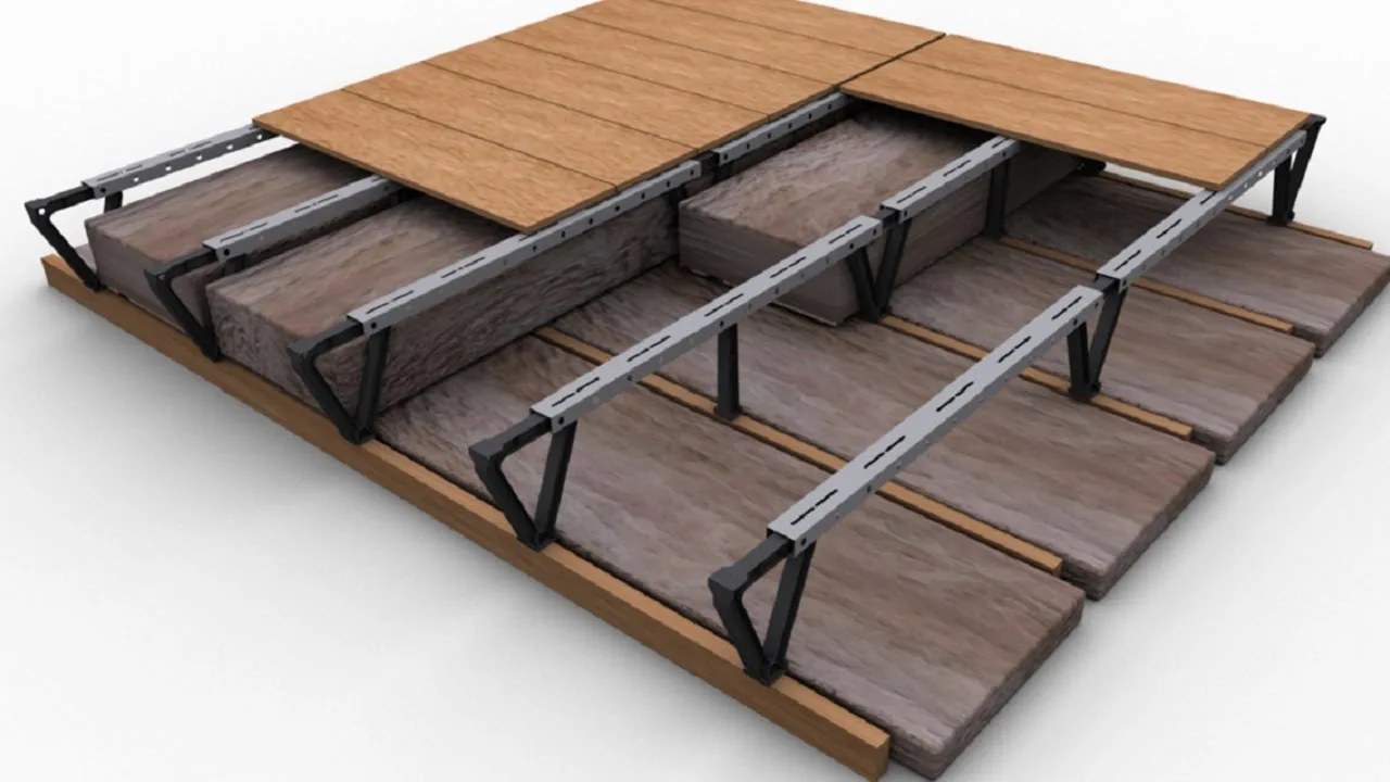 Raised loft boarding fitted across a roof space, with the timber trusses either side
